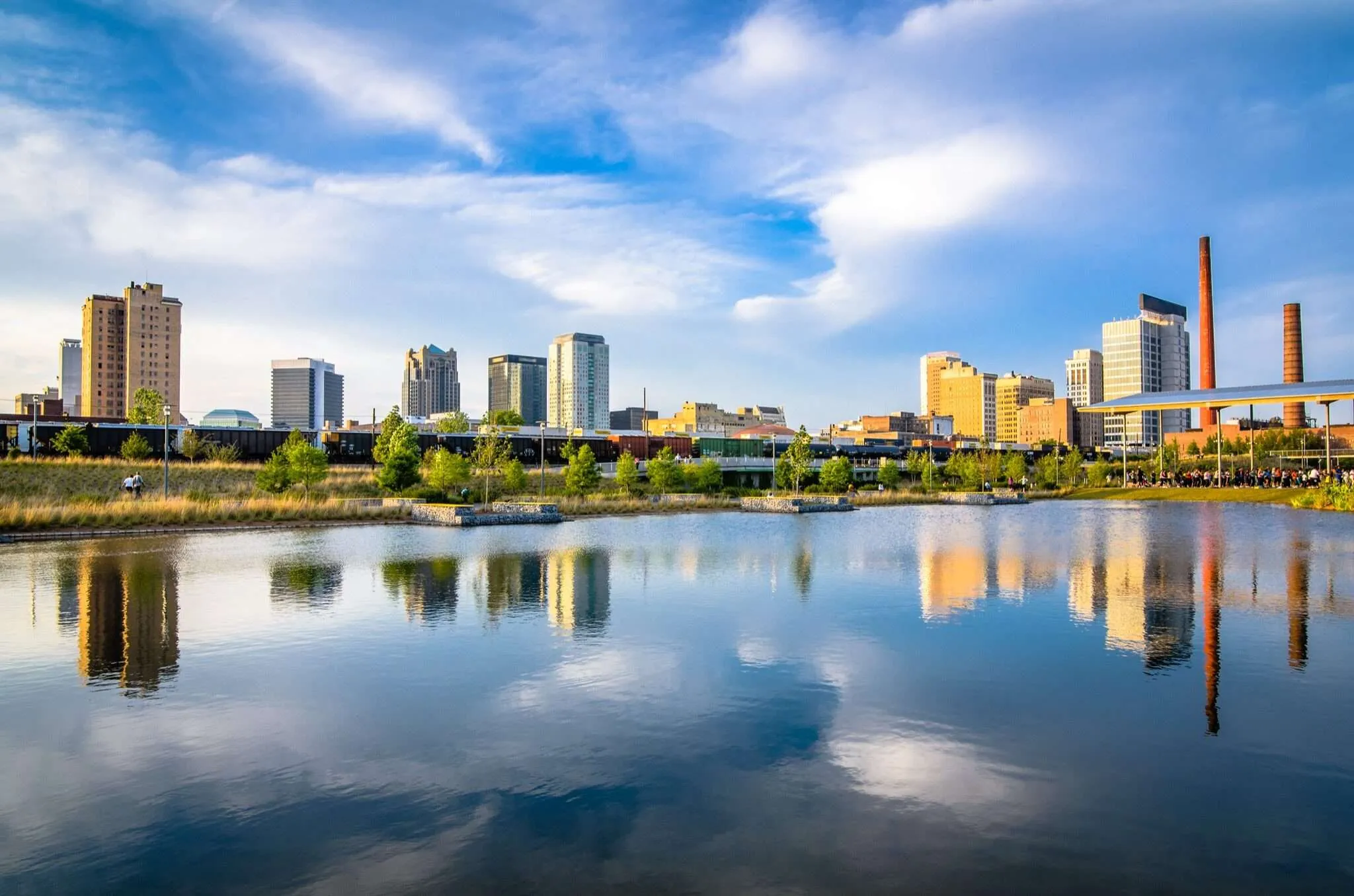 Birmingham Alabama skyline reflected in Railroad Park lake