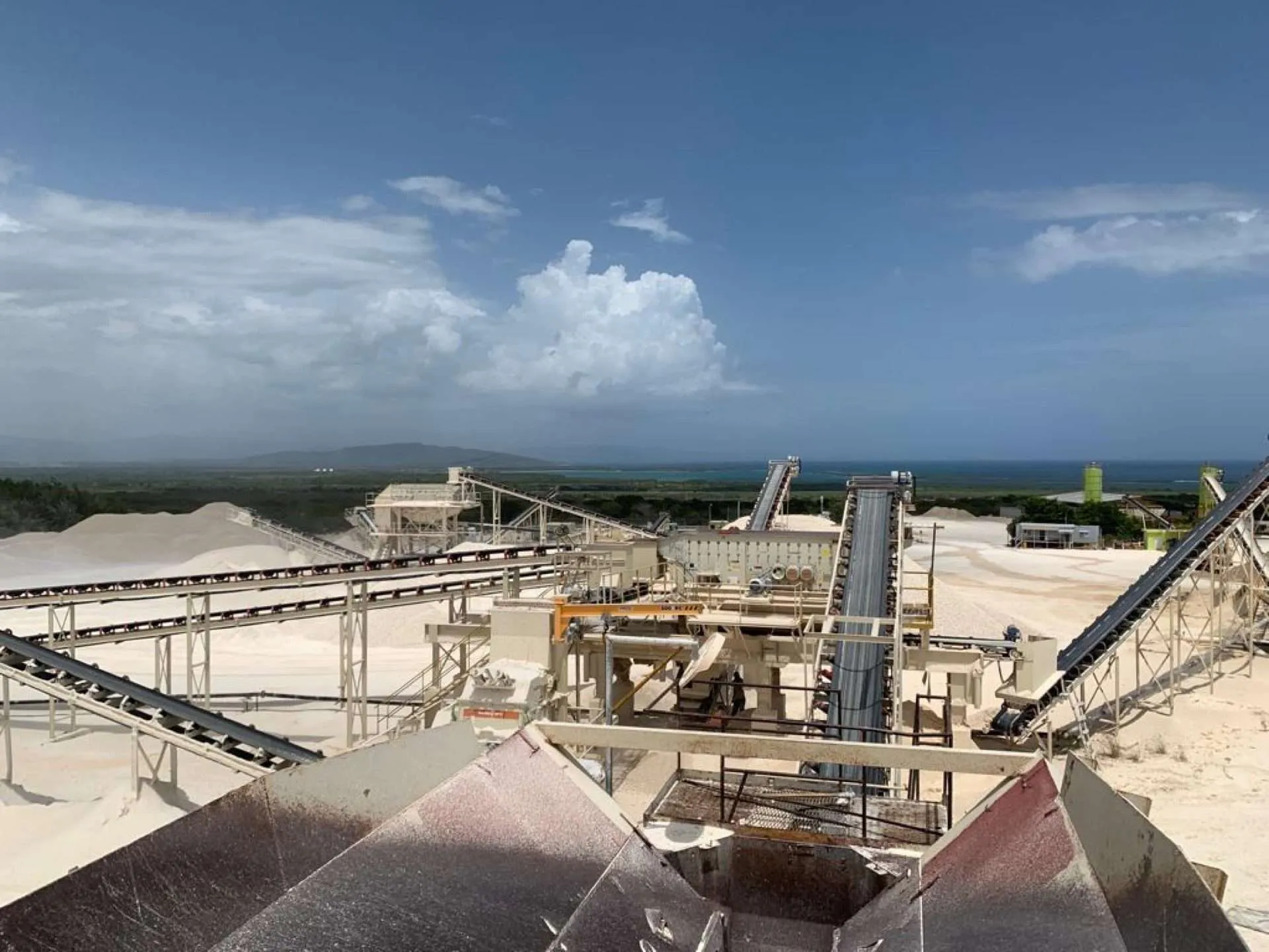Volvo excavator working in Interagg limestone quarry pit in the Dominican Republic